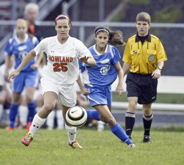 William D. Lewis  The Vindicator Howland's Jenna dorchock goes for the ball during 9-14-11 game with Poland at Howland.