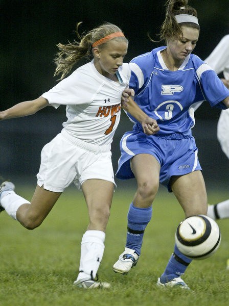 William D. Lewis  The Vindicator Howland's Jordan Entler and Poland's Channy Conzett during 9-14-11 game at Howland.