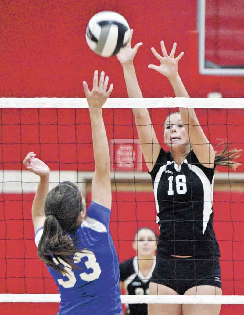William D Lewis The Vindicator  Canfield's Holly Rolla hits the ball past Poland's Mackenzie Mulligan during Thursday action at Canfield.