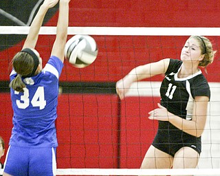 William D Lewis The Vindicator  Canfield's Sabrina Mangapora hits the ball past Poland's Arlia Duarte during Thursday action at Canfield.