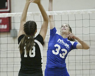 William D Lewis The Vindicator  Canfield's Holly Rolla #18 tries to block a shot by Mackenzie Mulligan of Poland during Thursday action at Canfield.