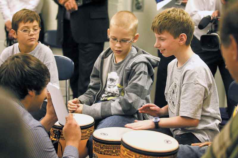 Nick Oblinsky, 12, plays a set of notes by tapping his drum during a demonstration Thursday of the Youngstown State University SMARTS Rhythmic Arts Project at the Potential Development Center.
