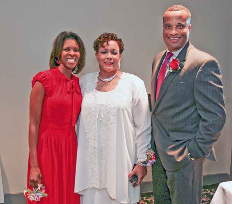 The Williamses pose for a photo with Jaladah Aslam, president of the Youngstown Warren Black Caucus. The event is the organization’s main fundraiser.