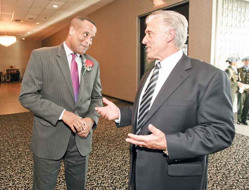 Youngstown’s former mayor Jay Williams and Mayor Chuck Sammarone chat at Mr. Anthony’s in Boardman. The Youngstown Warren Black Caucus hosted a dinner Friday to honor Williams.