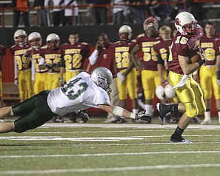 ROBERT  K.  YOSAY  | THE VINDICATOR --.. QB P J  Quinn breaks for a first down in the drive for  their first score  #43 Lake is Jim Szep during first quarter aciton..Mooneys #Youngstown Cardinal Mooney played Lake Catholic Cougars at Stambaugh Stadium..--30-..(AP Photo/The Vindicator, Robert K. Yosay)