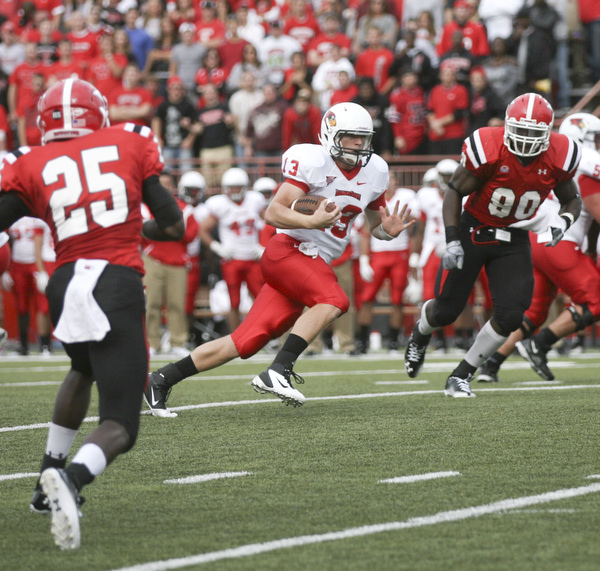 JESSICA M. KANALAS | THE VINDICATOR..Illinois State's quarterback Matt Brown rushes for 6 yards and is taken down by Youngstown State's safety Jeremey Edwards in the third quarter...-30