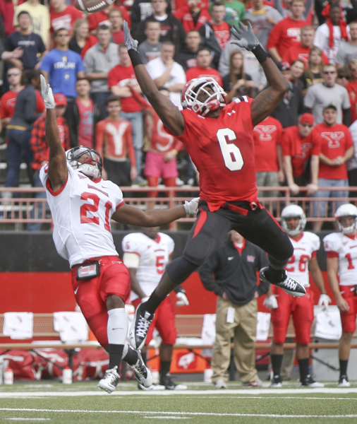 JESSICA M. KANALAS | THE VINDICATOR..Youngstown's wide receiver Jelani Berassa, 6, reaches for a pass from quarterback Kurt Hess in the second quarter of yesterday's game against Illinois State.  The Penguins beat the Redbirds 34-27...-30