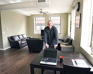 Phil Kidd enjoys his downtown Youngstown apartment in the Federal Building at Phelps and West Federal streets. Kidd, who works on neighborhood engagement and organizing issues for the Mahoning Valley Organizing Collaborative, is one of Youngstown’s most vocal and visible boosters. Kidd was the last tenant at the Federal Building, moving in last month.