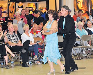 Len Rome and Mary Ann Ebert of Youngstown show off their moves during a ballroom-dancing event Saturday at Eastwood Mall.