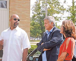 Frederick Torres, left, project manager and partner in the North Twelve Property Management Group, speaks about the renovated Liberty Pride Apartments with Patrick Ungaro, Liberty Township administrator, and Trustee Jodi Stoyak. The apartments are at Colonial and Green Acres drives.