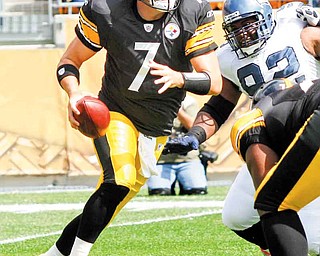 Pittsburgh Steelers quarterback Ben Roethlisberger (7) scrambles away from Seattle Seahawks defensive tackle Brandon Mebane (92) in the first quarter of an NFL football game on Sunday, Sept. 18, 2011, in Pittsburgh. (AP Photo/Keith Srakocic)