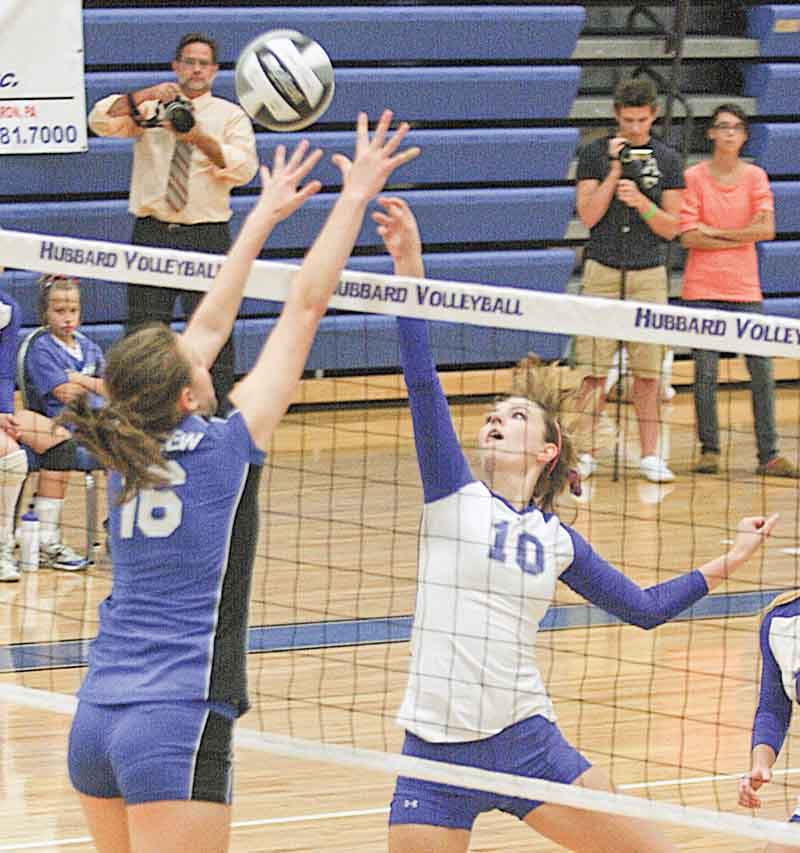 Hubbard’s Taylor Greathouse (10) and Lakeview’s Marissa Naples battle at the net Monday evening in Hubbard. The Bulldogs defeated the Eagles in four sets.