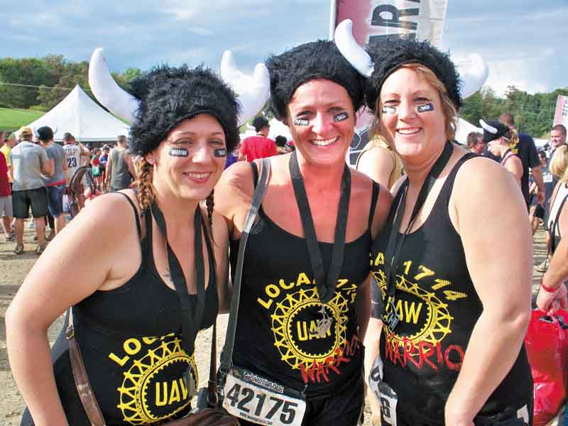 Wendy Fry-Mcmurray of Boardman, Kasey King of Austintown and Tammy Metzgar-Daggy of Salem wear warrior hats Sept. 10 at the Warrior Dash Ohio II in Carrollton, Ohio. More than 10,000 people completed 12 obstacles during the 3.1-mile course.