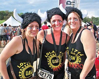 Wendy Fry-Mcmurray of Boardman, Kasey King of Austintown and Tammy Metzgar-Daggy of Salem wear warrior hats Sept. 10 at the Warrior Dash Ohio II in Carrollton, Ohio. More than 10,000 people completed 12 obstacles during the 3.1-mile course.