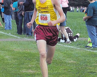 Ryan Roush of South Range finishes first Tuesday afternoon in Canfield. He crossed the finish line with a time of 16:10. Mark Hadley of Boardman placed second and Roush’s Raider teammate, Tim Nichols was third.