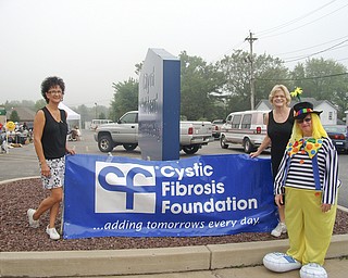 Sale raises funds for cystic fibrosis:
Marilyn Hanley, left, Kathy O’Nesti and Buttercup the Clown take a moment from the Cystic Fibrosis trash and treasure sale Aug. 20 in the Hubbard City Building parking lot. The event raised more than $2,300 for cystic-fibrosis research. Contributing to the event’s success were Ed, Alex and Christine McCann, who provided and assembled the tents; ABC Party Rentals, which provided the tables; Belleria Pizza; Save-A-Lot; Circle K; Ron’s Sign Shop; Dollar General; Buttercup; and Jugenheimer Storage.