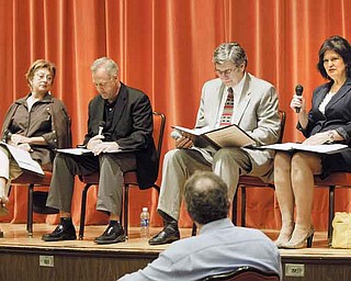 Cast members of the dramatic reading of “Who Shall Live ...?” rehearse their parts under the guidance of Rabbi Franklin W. Muller of Congregation Rodef Sholom in Youngstown. From left are Debbie Heiman, Steve Baroff, Arthur Greenbaum and Pamela Dutro.