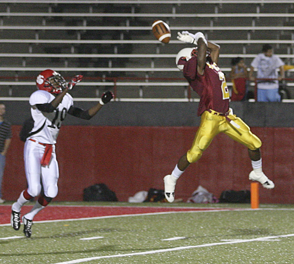 JESSICA M. KANALAS | THE VINDICATOR ..Mooney's junior cornerback Kareem Ellis almost intercepts a pass intended for sophomore wide receiver Frederick Canteen II of the Red Lion Christian Academy's during the second quarter of Saturday night's game at YSU stadium. ..-30