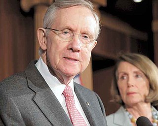 Senate Majority Leader Harry Reid of Nev., left, accompanied by House Minority Leader Nancy Pelosi of Calif., take part in a news conference on Capitol Hill in Washington, Friday, Sept. 23 2011, to talk about their conflict with Republican lawmakers over whether funding for victims of natural disasters should be paid for by cuts to other government programs. (AP Photo/J. Scott Applewhite)