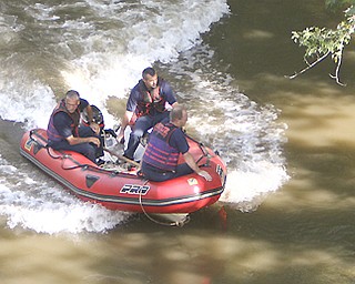 Youngstown firefighters search the Mahoning River east, almost to the Center Street bridge, looking for clues Tuesday in the disappearance of restaurant owner James Donofrio of Boardman.