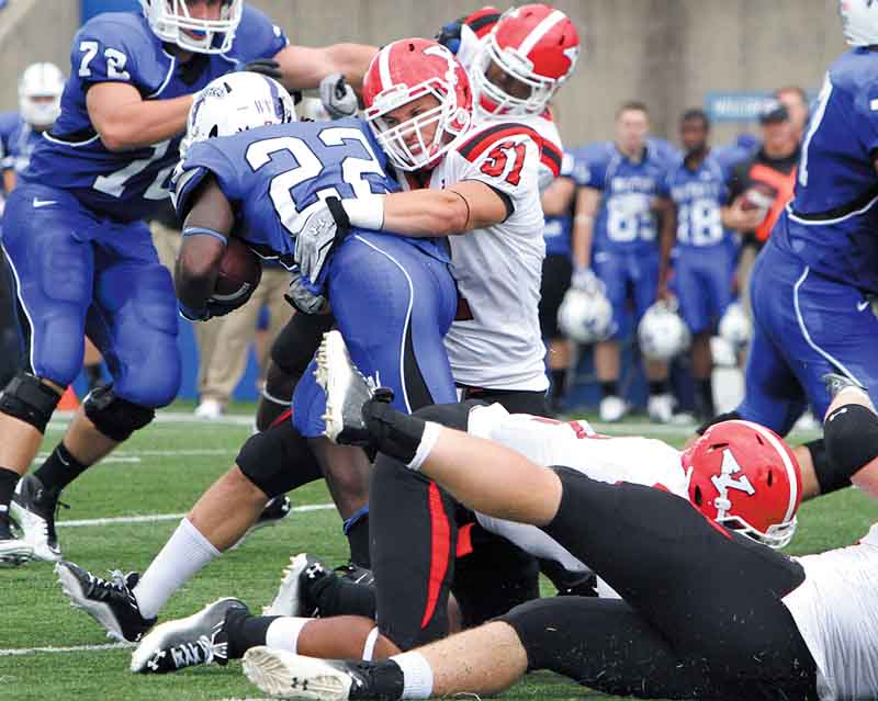 Youngstown State linebacker Ali Cheaib wraps up Indiana State running back Shakir Bell during their game Saturday in Terre Haute, Ind.