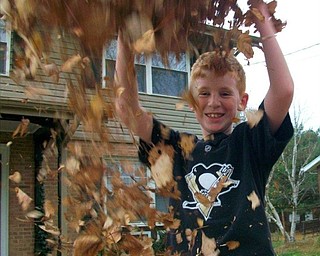 June Carr of New Castle, Pa., sent in this photo of her grandson Andy, who was throwing leaves on his mom, Janet, who took this action shot as it was happening.