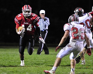 Struthers running back #44 Dave Stewart runs in the open field for a postive gain.