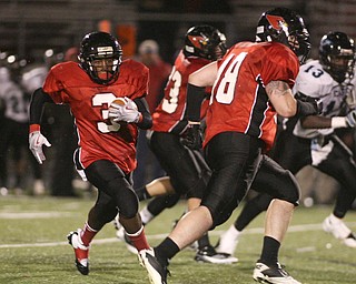 ROBERT K. YOSAY | THE VINDICATOR...#3 Bryce Jackson - follows #48 Jimmy Rousher as he scrambles for a first down as .East Panthers at Canfield Cardinals .....-30