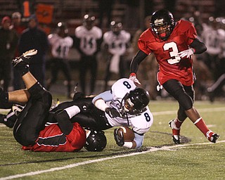 ROBERT K. YOSAY | THE VINDICATOR..#8 East - DD Fleetion brought down hard by #2 Jordan Italiano and #3 Bryce Jackson ..East Panthers at Canfield Cardinals .....-30