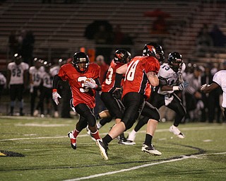 ROBERT K. YOSAY | THE VINDICATOR...#3 Bryce Jackson - follows #48 Jimmy Rousher as he scrambles for a first down as .East Panthers at Canfield Cardinals .....-30