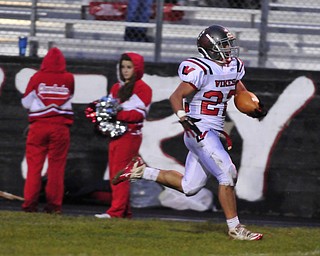 Running back Matt Szorady #22 of Labrae runs down the sideline for the 60+ yard touchdown.