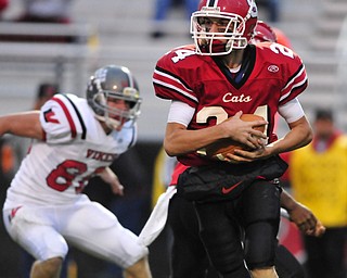 Receiver Bobby Milone #24 of Struthers looks for room on the end around.