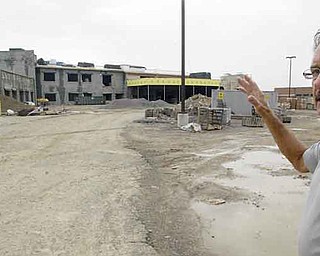 Hubbard schools Superintendent Richard Buchenic stands near construction of the district’s new middle school. The building, which will connect the elementary and high schools, is scheduled to be completed in 2013.