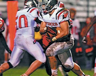 Running back Matt Szorady #22 of Labrae runs the ball upfield for postive yardage.
