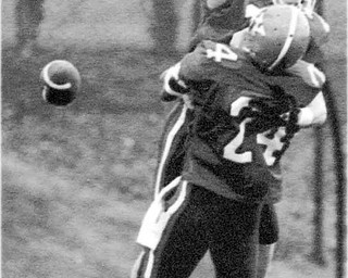 01/17/91 - Doug Oster.YSU vs Villanova: YSU wins - Dave Roberts of YSU celebrates scoring a TD with #24 Herb Williams. This was YSU's first score.