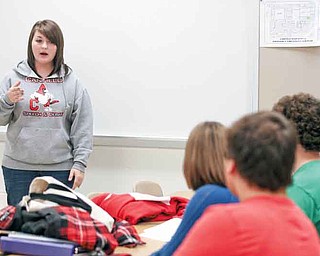 Canfield High School senior Kaylee Kapalko gives an impromptu speech Monday during the team’s after-school practice.