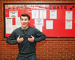 Junior Nathan Pecchia shows off one of the poses he uses while competing in duo interpretation for the Canfield High School speech team. He finished second at state competition with his partner, Rosie Jo Neddy.