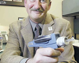 A “Star Trek: The Next Generation” buff , Matthew A. Stefanak III, retiring as health commissioner of the Mahoning County District Board of Health, shows off his Star Trek replica phaser. In announcing his retirement to the staff , he said: “The captain has decided to relinquish command of the star ship.”