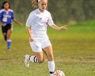 Mooney's #2 Amy Vinopal moves the ball up field during a game with CVCA.