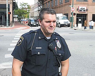 Youngstown patrolman Michael Cox said most people are glad to see uniformed officers walking the streets of downtown during the day.