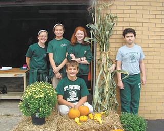SPECIAL TO THE VINDICATOR: The seventh-grade class at St. Patrick School in Hubbard is having its annual fall sale through Oct. 14 at the rectory garage, next to the school. The students, including standing, from left to right, Marie Bond, Sophie Madeline, Katie Fagundus and Greg Conners, and kneeling, Nathian Eigiacobbe, are selling items every day from 2:40 to 3:05 p.m. Items for sale include pumpkins for $3, $5 and $6; cornstalks for $2.50; bales of straw for $4; assorted mums for $5; gourds and jack-be-littles are two for $1; and 5-pound bags of red potatoes are $2.50. Proceeds will help pay for the students’ spring trip to Camp Fitch. For information call the school at 330-534-2509.