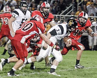 FOOTBALL - (3) Adam Coppock tries to beat the Columbiana defense led by (40) Brandon Hacker and (10) Austin Barbato Friday night. - Special to The Vindicator/Nick Mays