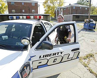Liberty policeman Sgt. Daniel Kovach inspects a vacant, southside apartment. As the line between the township and Youngstown blurs, drug-related crimes over the past decade have increased.