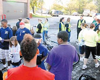 Several volunteers gather outside Campbell City Hall on Tenney Avenue to prepare to spend a portion of Saturday cleaning up a section of a major city thoroughfare. They cleared trash and cut grass on Wilson Avenue at Coitsville Road. The Campbell Pride Project will have a meeting at 6 p.m. Wednesday at the community center in Roosevelt Park for people interested in starting a block-watch program.