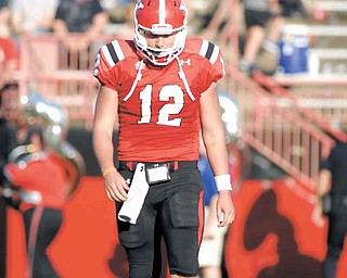 Youngstown State quarterback #12 Kurt Hess walks to the sideline after throwing an interception in the second quarter.