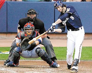 Milwaukee Brewers' Ryan Braun hits a two RBI double during the fifth inning of Game 1 of baseball's National League championship series against the St. Louis Cardinals Sunday, Oct. 9, 2011, in Milwaukee. (AP Photo/Jeff Roberson)