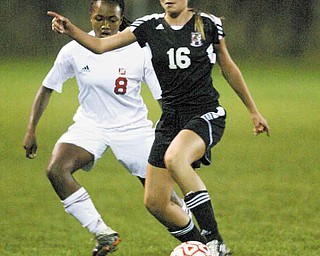 Mooney’s Lindsey Parkins closes in on Canfield’s Kaylee Buchenic (16) during Monday’s game. Parkins scored the gamewinning goal for Mooney. Buchenic had an assist for Canfield.