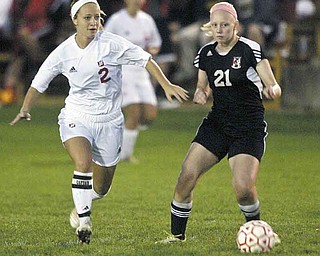 Mooney’s Amy Vinopal, left, and Canfield’s Erin McGraw go for the ball during Monday’s game at the Simon Soccer Park in Struthers. Vinopal scored two goals and assisted on the game-winning goal in Mooney’s 3-2 victory.