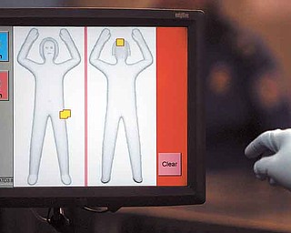 The new Advanced Imaging Technology machine at Youngstown-Warren Regional Airport in Vienna, which is equipped with automated target-recognition software, eliminates passenger-specific images and detects metallic or nonmetallic items, but does not show what those items look like.