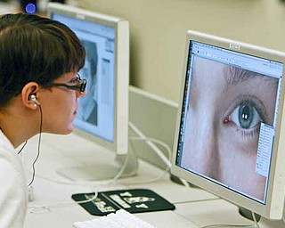 Leah Yochman, a senior from Jackson-Milton, works on part of her project at Mahoning County Career and Technical Center. Students in the school’s interactive multimedia/visual arts design class did marketing projects for MCCTC programs.